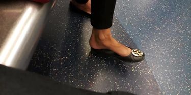 Candid closeup of blonde feet on train 25